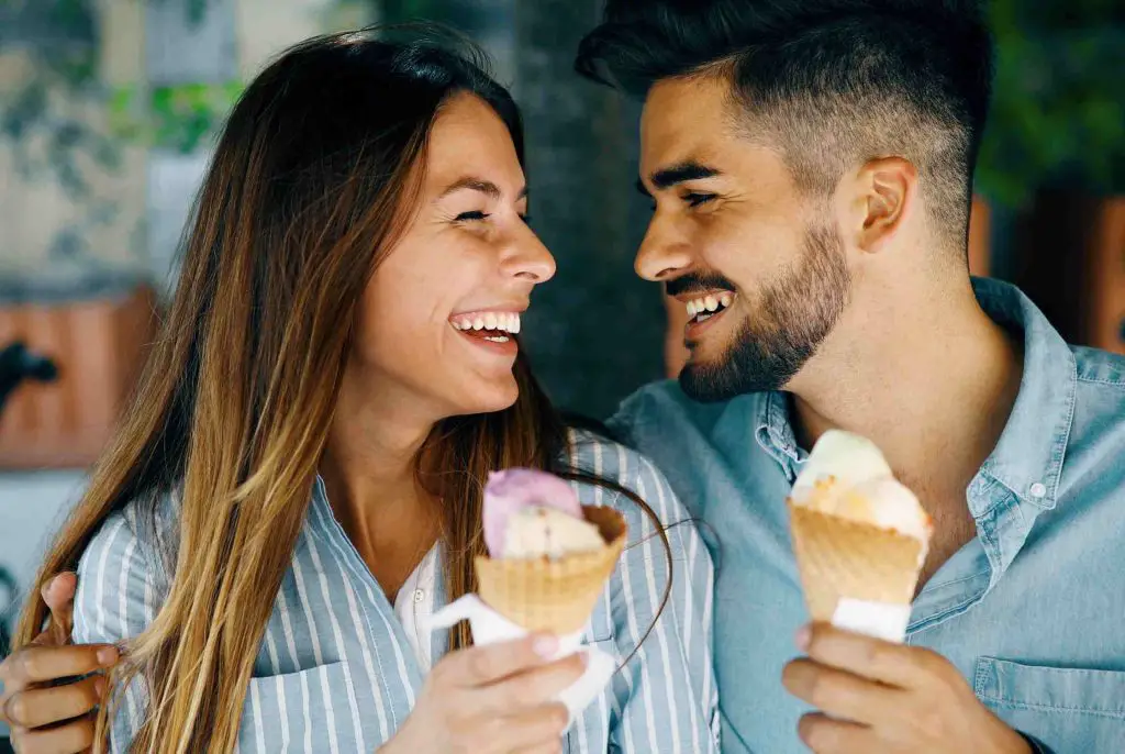 Happy couple eating ice cream